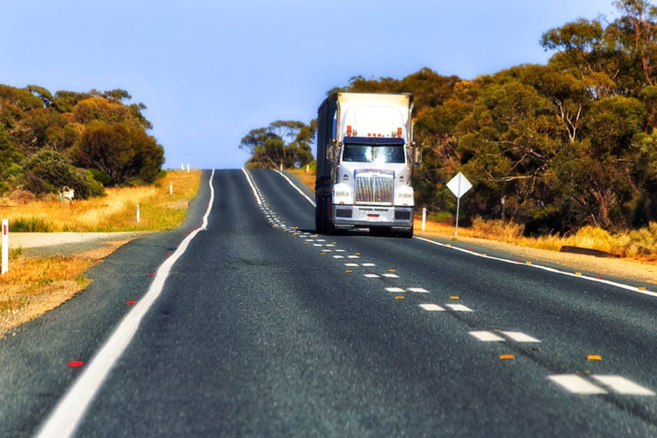 A truck driving on the road